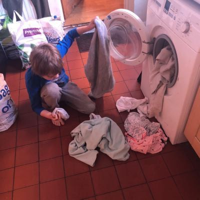 Mathew helping with the laundry